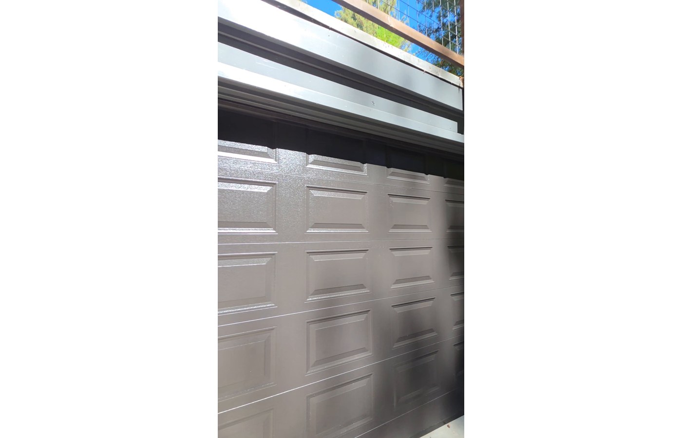 Black modern garage door installation